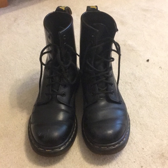 black boots with yellow tag